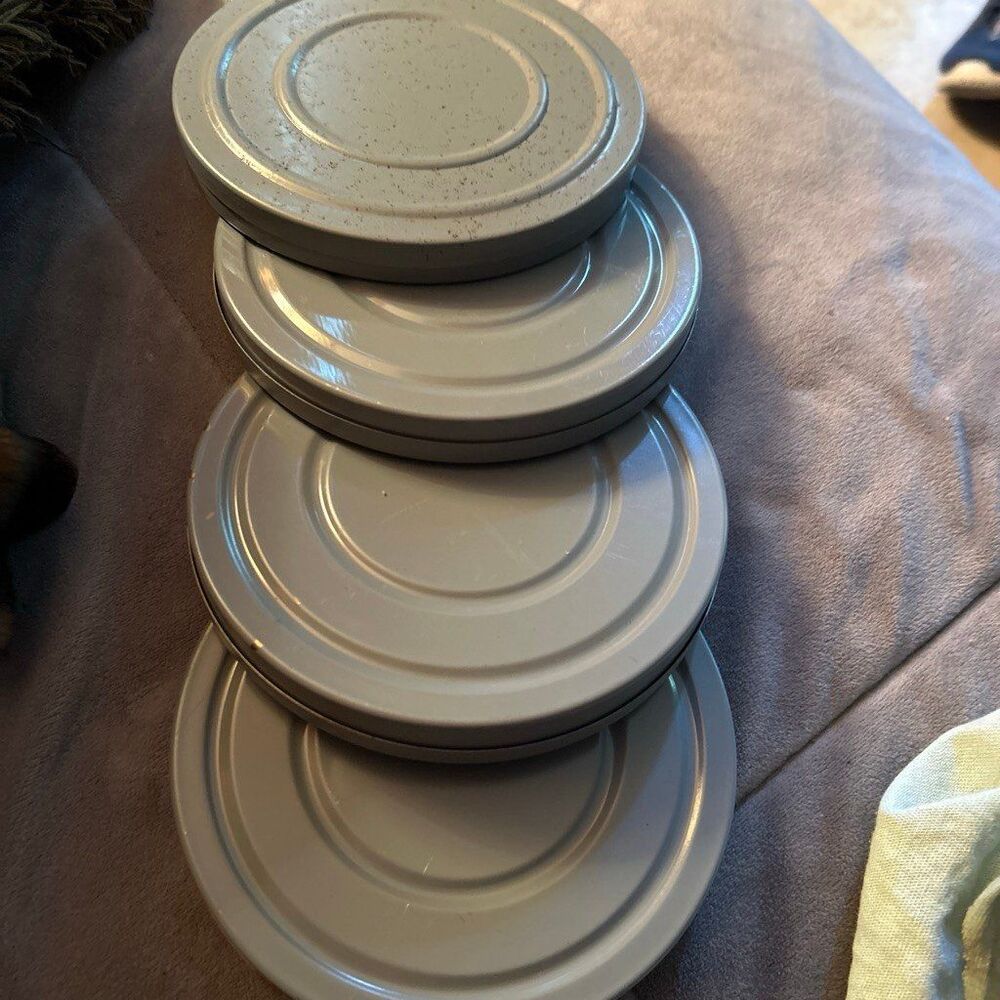 Film canisters (4) with same size empty reels inside